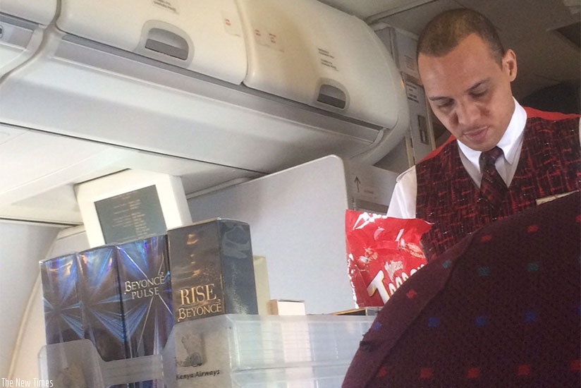 A Kenya Airways steward serves a customer. The airline is going through rough times. (Sandra Idossou.)