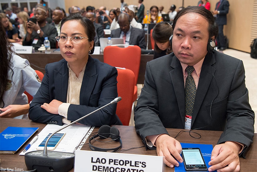 Participants follow proceedings during the talks in Kigali. (Timothy Kisambira.)