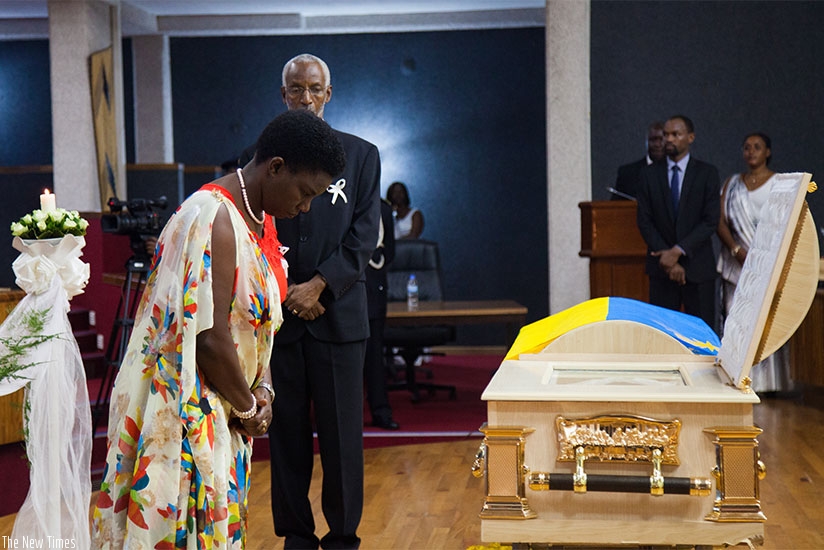 Minister Tugireyezu pays her last respects to the late Nyandwi at Parliament yesterday. (Nadege Imbabazi)rn