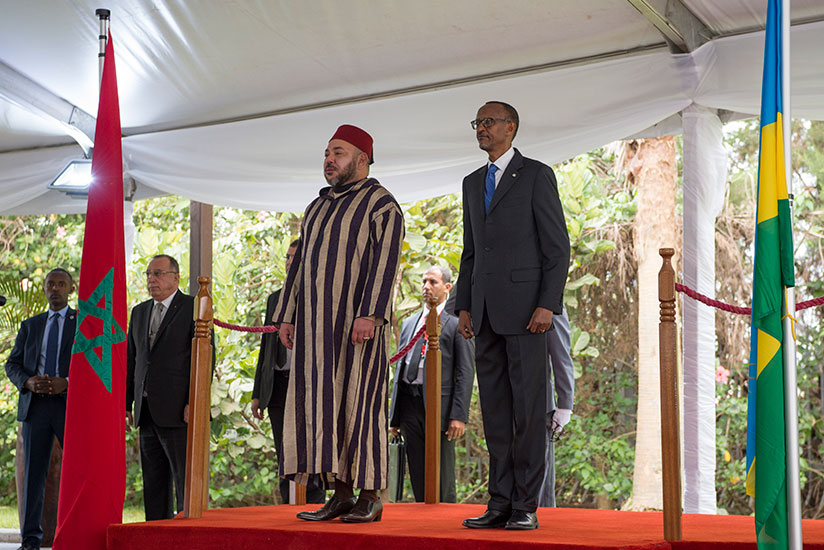President Paul Kagame and Moroccan King Mohammed VI observe the national anthems of the two countries upon the visiting monarch's arrival at Village Urugwiro in Kacyiru yesterday. ....