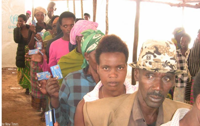 Congolese refugees in Nyabiheke queue to get their food allowance loaded onto their smartcards. (Kelly Rwamapera.)