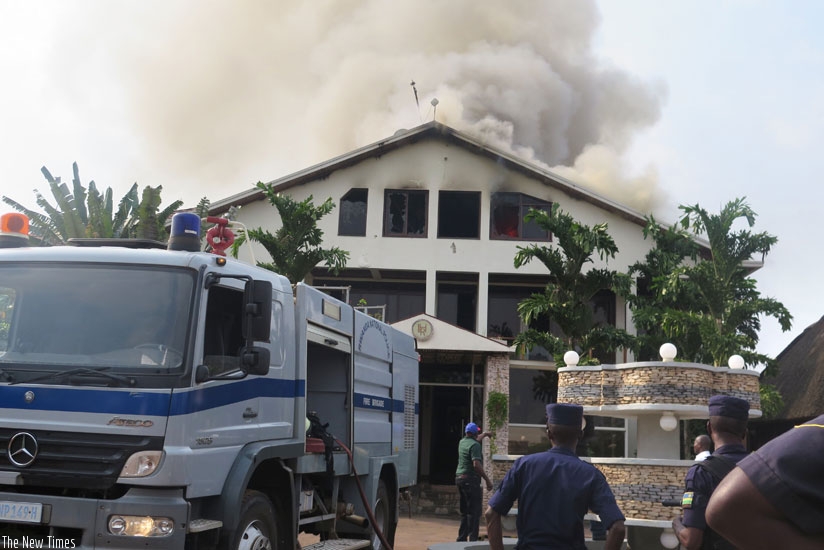 Fire fighters try to contain a fire at a complex in the past. The central bank has warned insurance companies against selling policies on credit and undercutting prices. (File photo)