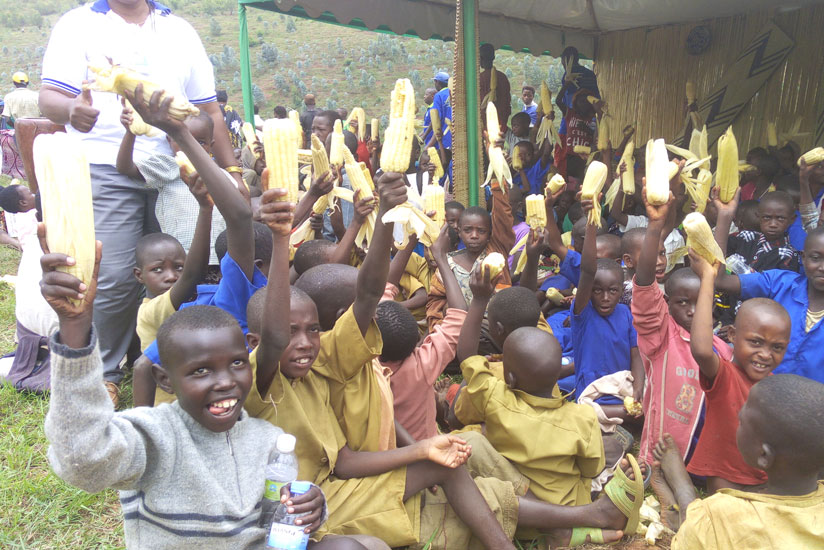 Children enjoy maize during World Food Day celebrations in Huye District on Thursday. / Emmanuel Ntirenganya