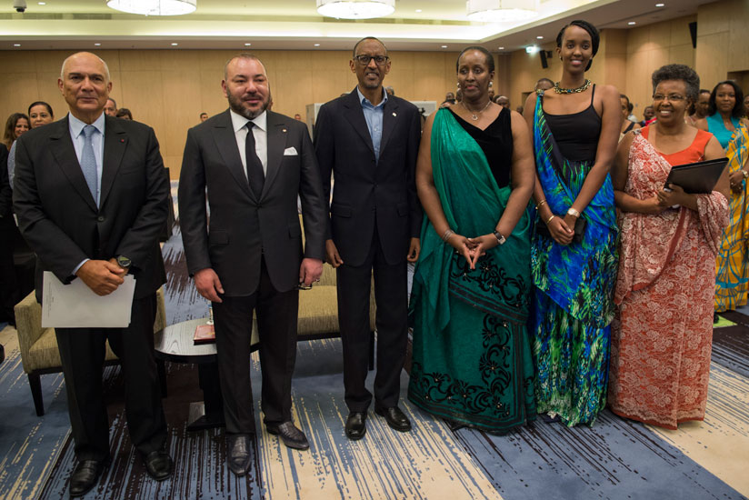 President Paul Kagame and visiting Moroccan King Mohammed VI pose for a group photo with the First Lady and Founding President of Imbuto Foundation Jeannette Kagame; first daughter....