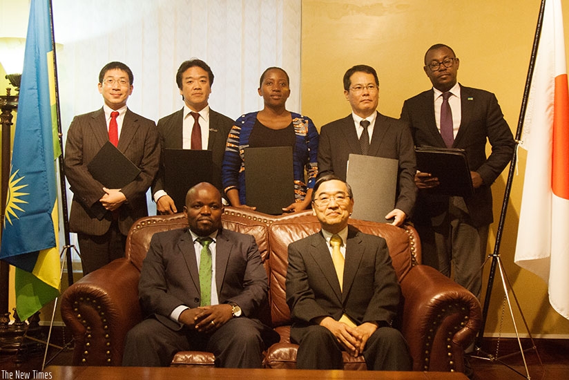 Minister Nsengimana and Amb. Miyashita with other officials pose for a photo after signing the agreement. / Nadege Imbabazi.