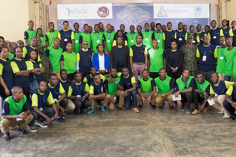Defence minister James Kabarebe (standing centre in black jacket), Alain Ngirinshuti from Ibuka France (to Kabarebe's left), Imbuto management and participants during the Leadershi....