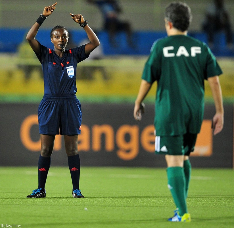 Salma Rhadia Mukansanga officiating at a game. / Internet photo.