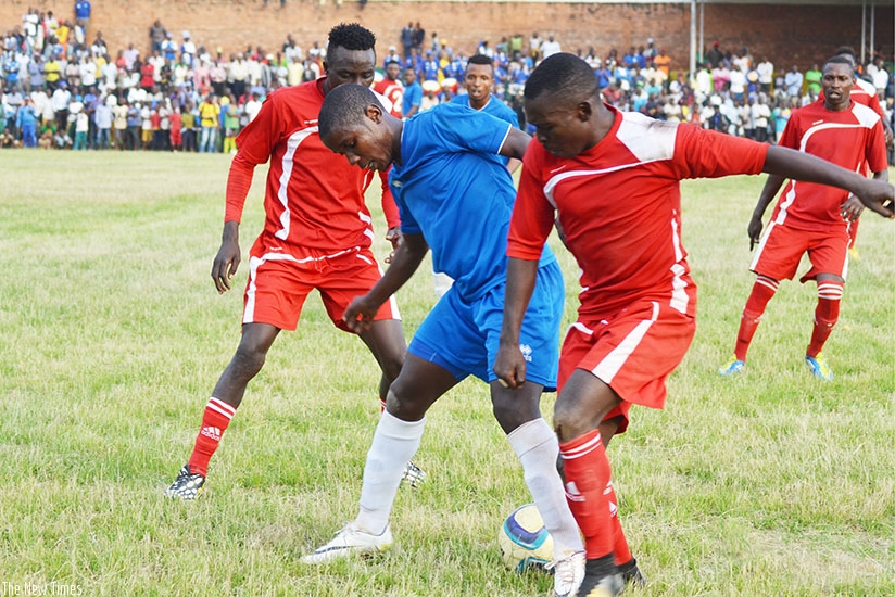 Rayon Sports' attacking midfielder Shasiri Nahimana tries to shield the ball from Espoir players during Saturday's goalless draw in Rusizi. / Sam Ngendahimana.