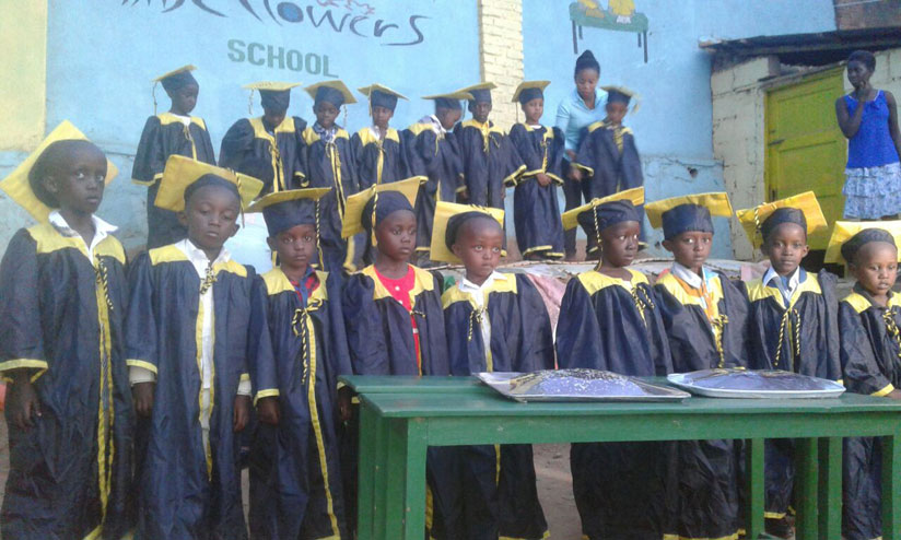 Pupils of Little Flowers donning gowns as they celebrate graduating from nursery. /  Hudson Kuteesa