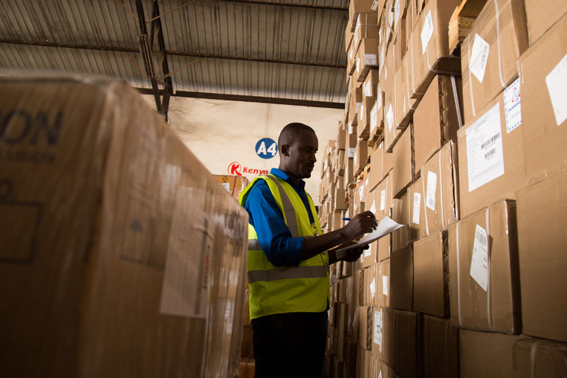 A worker at Magerwa bonded warehouse. The government is seeking to regulate warehouse services and value certificates for stored agricultural produce to boost commodities exchange.....