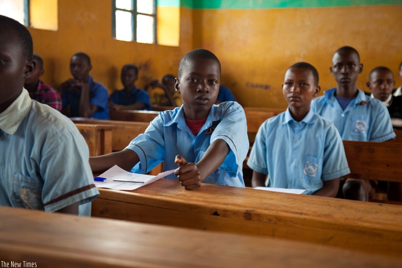 Pupils in Rwamagana await the start-time for examinations last year. Sixteen per cent more candidates will sit PLE this year. (File photo)