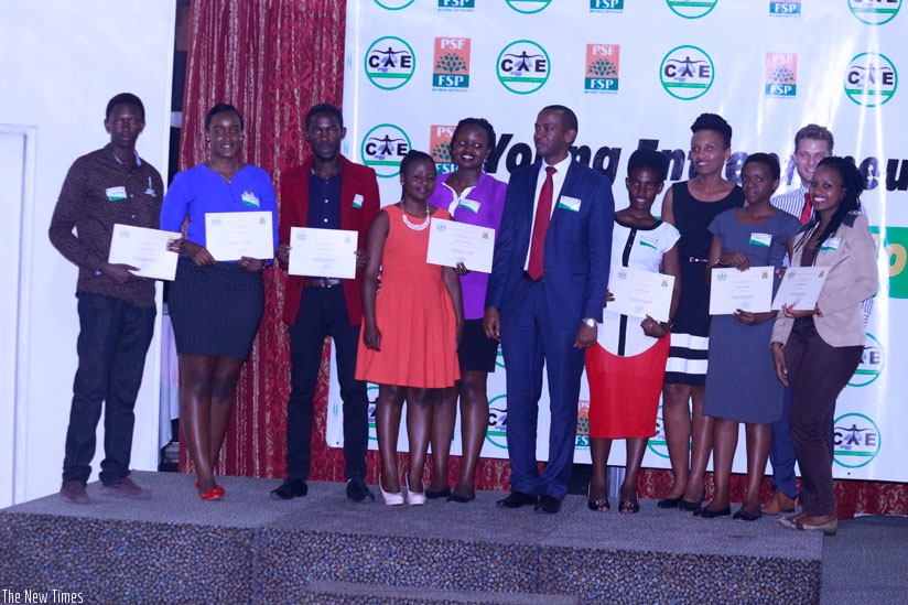 Some of the youths that pitched business ideas during the contest show off their certificates. Three youths with top ideas bagged a total of Rwf450,000 in start-up capital. (Photos....