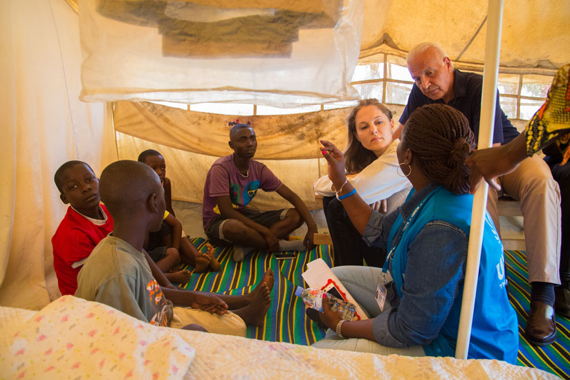 Inside a refugee shelter at the Mahama Refugee Camp, Princess Zeid listens to the story of some of the Burundian children who fled without their parents. / Faustin Niyigena