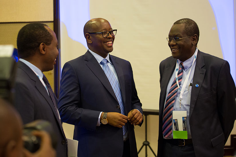 Musoni (C) chats with RDB chief executive Francis Gatare (L) and Cheluget after the opening of iPad summit yesterday. / Timothy Kisambira