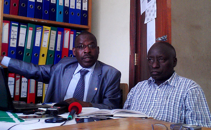 Ntakiyimana (L) speaks during the news conference as  Bicamumpaka looks on. / Frederic Byumvuhore