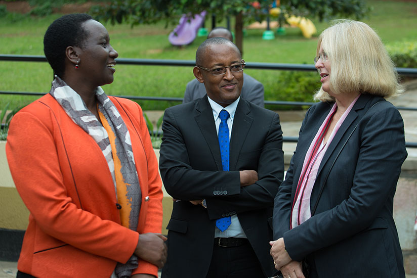 Uwacu (L) chats with Dr Diogene Bideri, a senior research consultant at CNLG (C), and Mechtild Rossler, director of heritage at UNESCO, in Kigali yesterday. / Timothy Kisambira