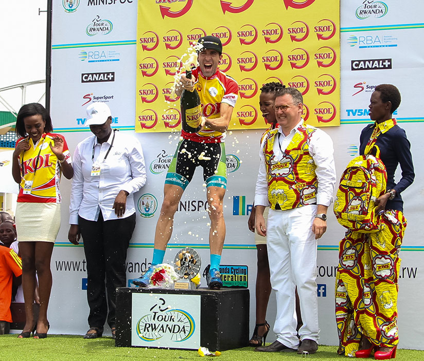 American rider Timothy Rugg (Team LowestRates from Canada) pops champagne on his victory yesterday. / Faustin Niyigena