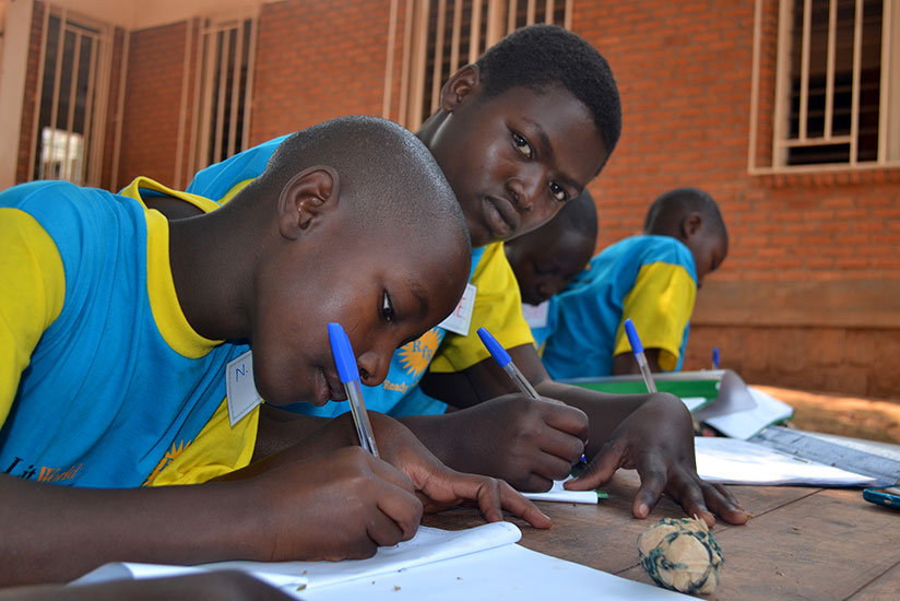Pupils at GS Nkondo in Kayonza District sit a literacy exam. Some stakeholders in education are calling for the revision of the automatic promotion policy saying it promotes laziness and complacency among learners. / Lydia Atieno