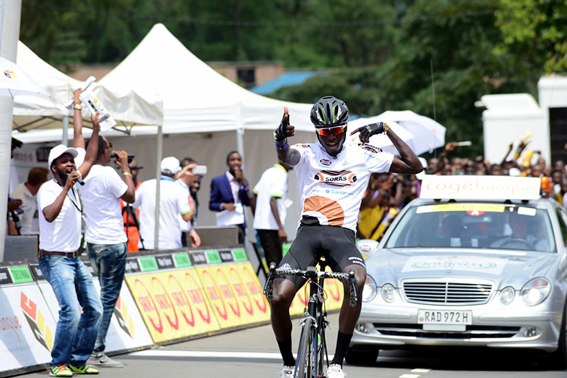Valens Ndayisenga celebrates as he crossed the finish line after winning stage 2, Kigali-Karongi on Tuesday. / Courtesy