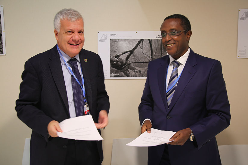 Gian Luca Galletti, Italy's Minister for the Environment, Land and Sea and Dr. Vincent Biruta, Rwanda's Natural Resources Minister after the signing the MoU at the Blue Zone during the summit on Tuesday. / Courtesy 
