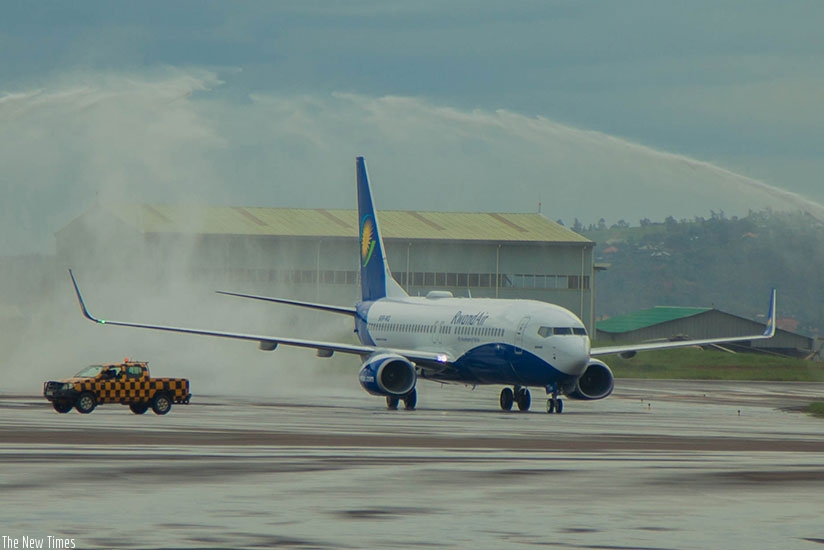 Africa's first Wi-Fi-connected Boeing 737-800NG, the pride of national carrier RwandAir, is welcomed by the fireman salute at Kigali International Airport yesterday. (All photos by Nadege Imbabazi)
