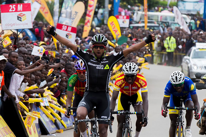 Eyob Metkel celebrates after winning stage five from Muhanga to Musanze. / Faustin Niyigena