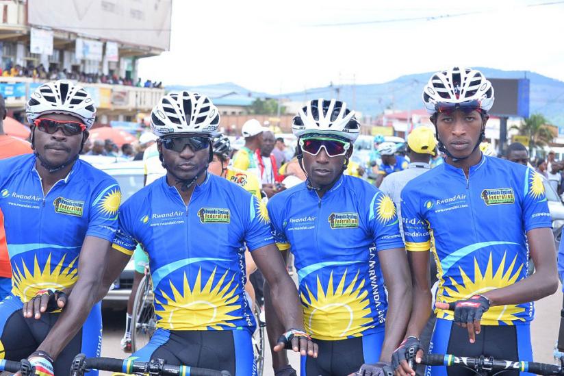 Nathan Byukusenge (2nd from right) with his Team Rwanda teammates before stage 5 of Tour du Rwanda, Muhanga-Musanze yesterday. / Courtesy