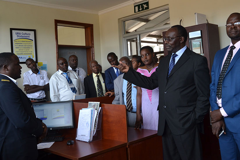 Minister Kanimba and his counterpart Julius Wandera Maganda during the visit at Uganda Revenue Authority offices. / Jean d'Amour Mbonyinshuti