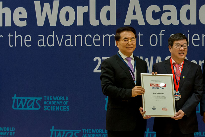 Bai Chunli, the president of TWAS( L) poses for a photo with Zhoa Dongyuan, the TWAS-Lenovo prize winner 2016. / Timothy Kisambira