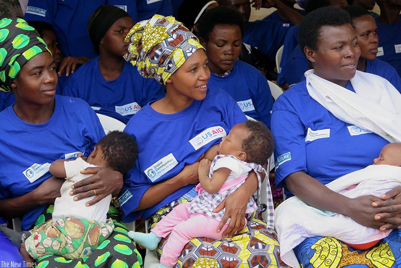 Mothers breastfeed their babies in Huye District during a breastfeeding and anti-malnutrition campaign last year. The new maternity leave benefits scheme will enable working mothers to attend to their children uninterrupted for the first three months. (File photo)