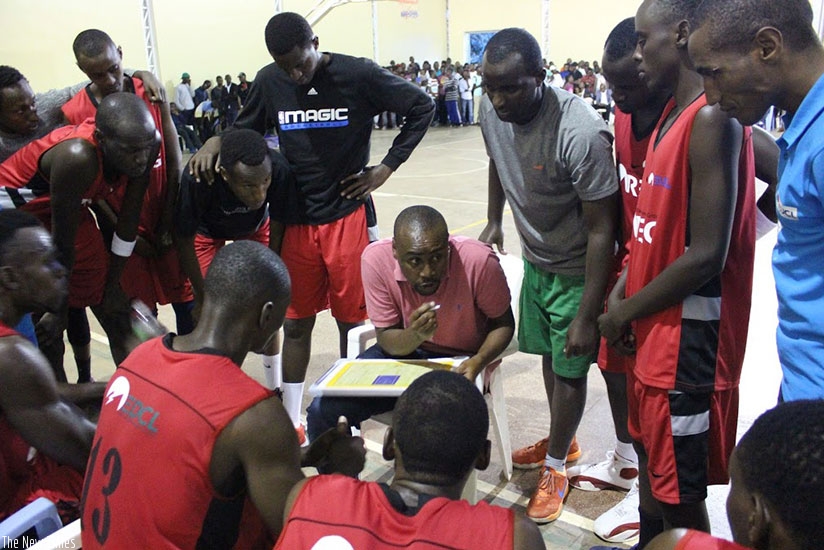 REG coach Bahufite talking to his players during time out in the game against  IPRC-Kigali on Saturday. (J. Muhinde)
