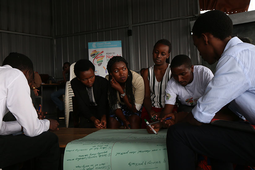At Kigali Impact Hub, one of the young youth entrepreneurs explains to his peers about his innovation. / Remy Niyingize