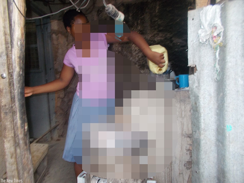 A minor caught up in domestic child labour prepares the family meal. (Photos by Elias Hakizimana)