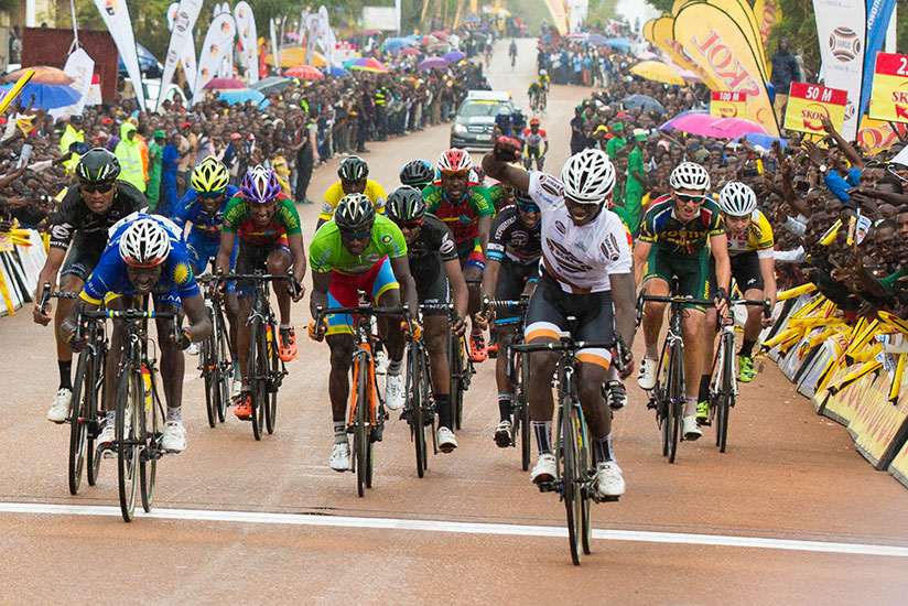 Joseph Areruya crosses first the finishing line of stage four in Huye town during the 2016 Tour du Rwanda. / Faustin Niyigena