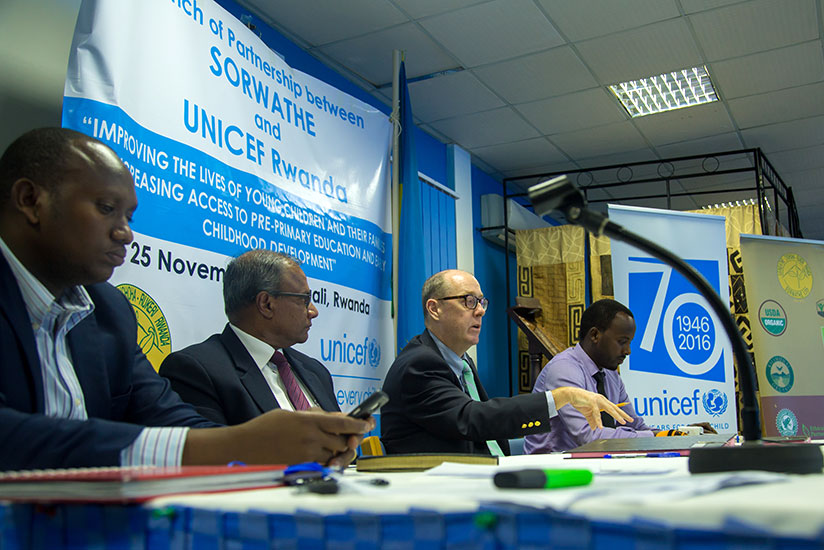 UNICEF country representative Ted Maly (second-right) gives his remarks as John Ntigengwa, the deputy director-general Imbuto Foundation (L), SORWATHE director-general Rohith Peiris (second-left), and Issa Nkurunziza, the National Agricultural Exports Development Board tea division manager, look on. / Timothy Kisambira