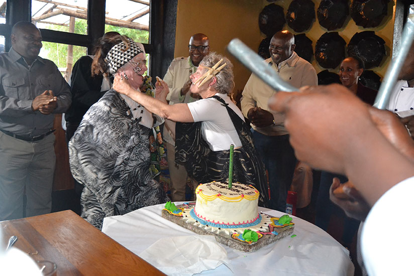Mary Anne McDonald serves cake to celebrate 100 times of Gorilla trekking. / Courtesy