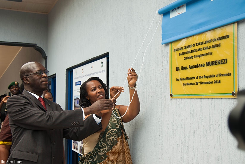 Prime Minister Anastase Murekezi (L) and the Minister for Gender and Family Promotion, Esperance Nyirasafari, officially inaugurate the Regional Centre of Excellence against gender-based violence at Rwanda National Police General Headquarters in Kacyiru yesterday. (Photos by Nadege Imbabazi)