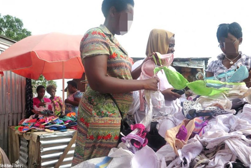 A used bra seller (L) helps her clients make choices in Nyamirambo market in Kigali. (File)