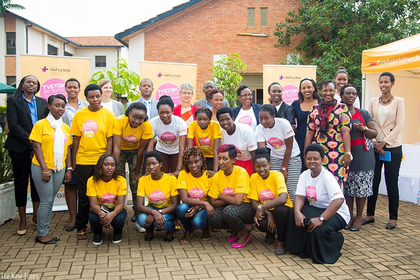 Officials and role model girls and women who have graduated from or who are still doing Science, Technology and Mathematics (STEM) related trades pose for a group photo yesterday (Photos by F. Niyigena)