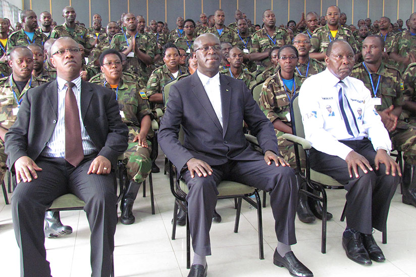 State minister for health Dr. Ndimubanzi, Prime Minister Murekezi and Itorero Chairman Rucagu in a group photo with the health workers yesterday. / Hudson Kuteesa