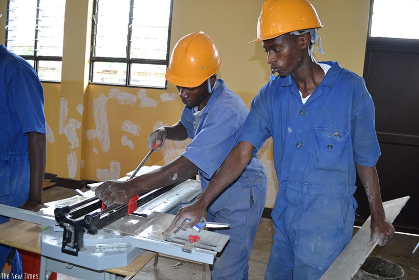 TVET trainees cut tiles. (Photos by Kelly Rwamapera)