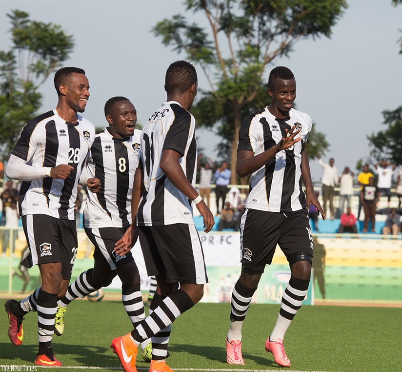 APR FC players Join Usengimana Faustin (R) to celebrate his second goal. (All photos by Timothy Kisambira)
