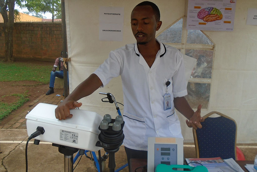 A medic explains how a massaging machine works. Such machines can be used to ease joint pains. / Lydia Atieno