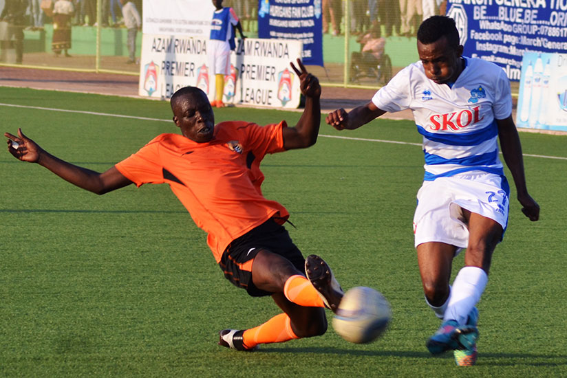 Dominique Savio Nshuti of Rayon Sports tries to cross the ball as a Bugesera FC defender dives in during a previous league match. Rayon host Gicumbi FC today at Kigali Regional Stadium. / Sam Ngendahimana