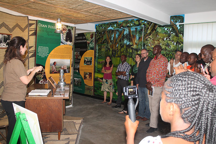 Veronica Vecellio, gorilla program and public relations manager at Karisoke, takes guests through the Dian Fossey room. / Moses Opobo
