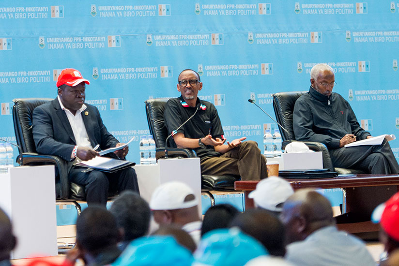 President Kagame, flanked by RPF Vice Chairman Christophe Bazivamo (L) and the party's Secretary-General Francois Ngarambe, speaks at the RPF Political Bureau meeting at Kigali Convention Centre yesterday. / Village Urugwiro