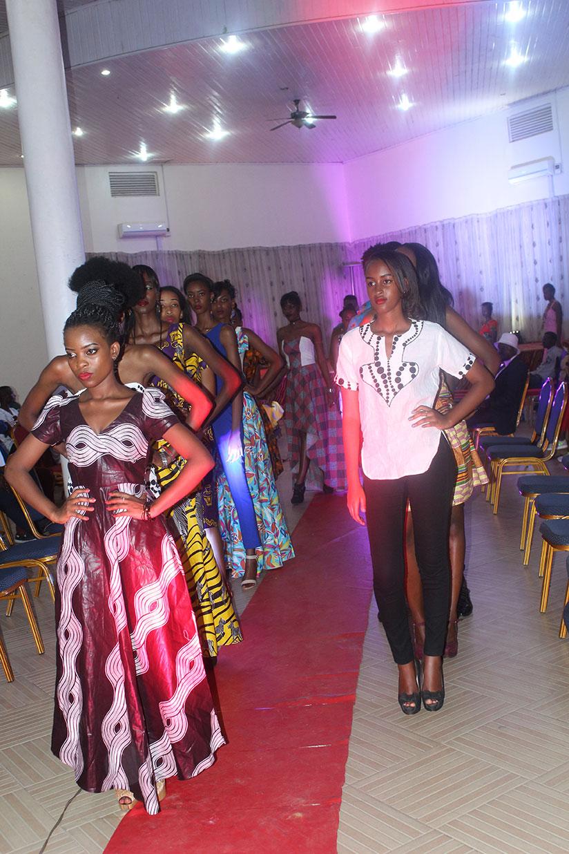 Models present some of the creations from designers who took part in the Invention Fashion show, at Sports View hotel. / Donata Kiiza