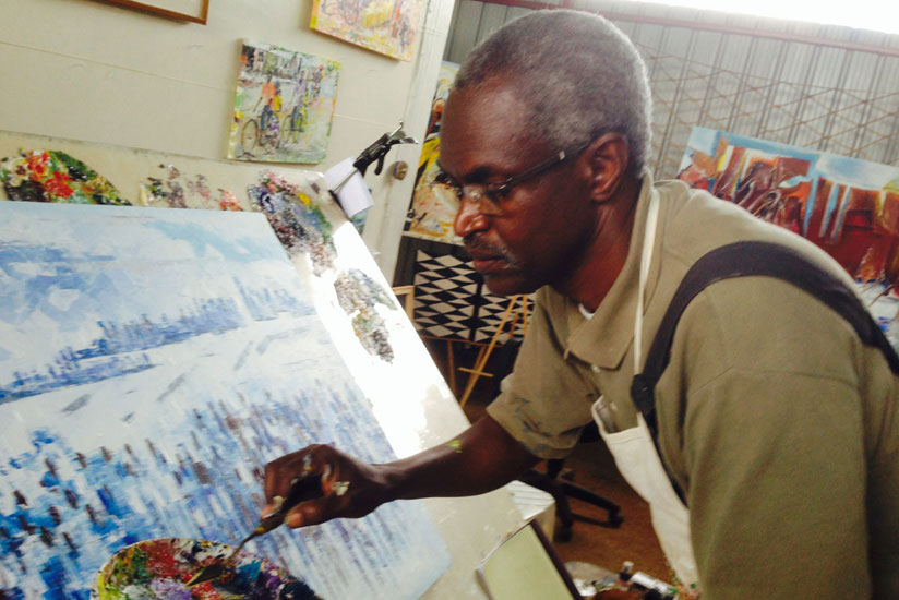 Epa Binamungu puts the final touches on his piece of artwork. / File