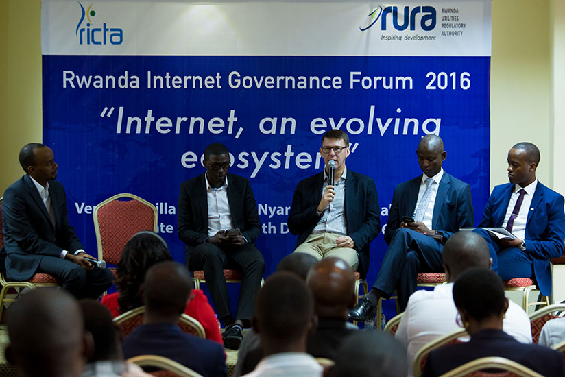 Panelists (L-R) Ghislain Nkeramugaba, the CEO of Rwanda Information & Communication Technology Association, Fiacre Mushimire Emerging comm.Tech Analyst, Martin Saint from Carnegie Mellon University, John Karamuka Bagirishya director Payment Systems Department National Bank and Rugemanshuro Regis business director BK Telecom limited during a discussion. / Timothy Kisambira