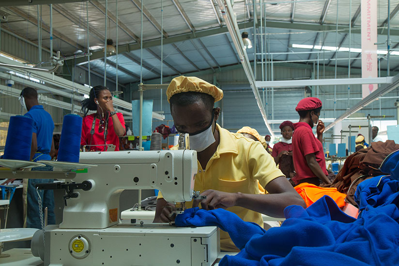 Workers at C&H Garments, a local firm, make outfits. The second Made-in-Rwanda exhibition opens in Kigali today, with Trade, Industry and EAC Affairs minister Francois Kanimba calling for more value addition to locally-made products to attract local consumers and appeal to the regional market. /  Timothy Kisambira